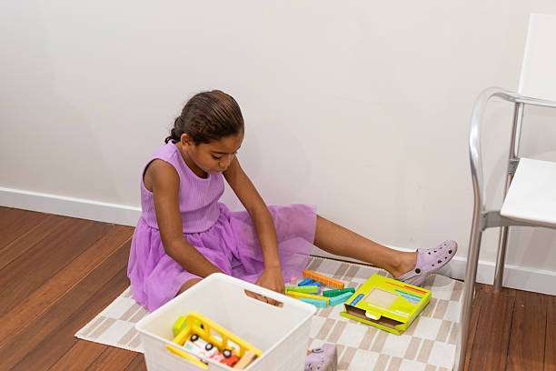 Young Australian Aboriginal girl playing magnetic tiles