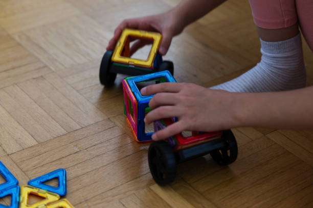 Close-up of a triangle from a children's magnetic tiles color 