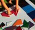 The child plays with a colorful magnetic tiles constructor. Close-up. Ball.